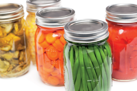 Mason jars filled with colorful preserved foods
